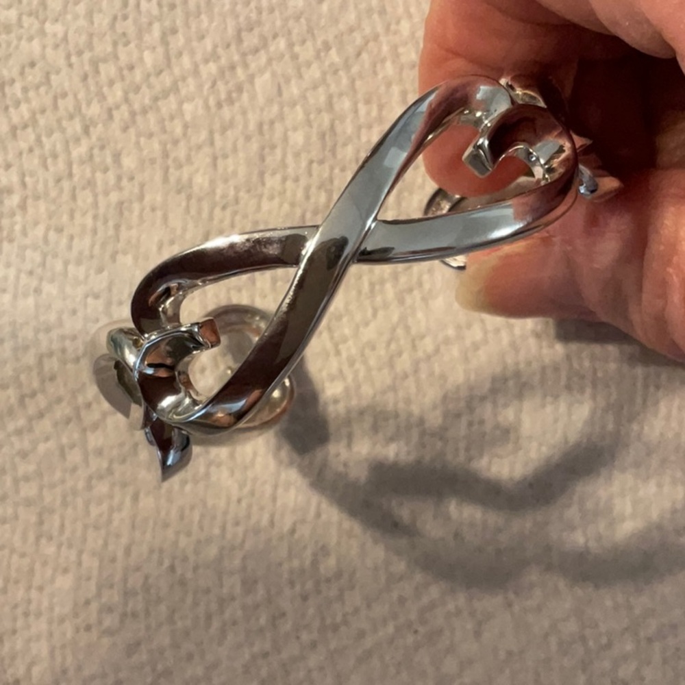 Silver plated bracelet with connecting hearts and great condition.